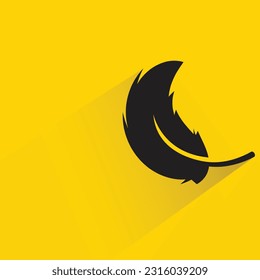 feather with shadow on yellow background