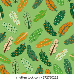 Feathers in dots in green, orange and brown colors cute disordered seamless pattern 