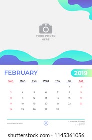 February 2019 calendar design. Simple green and purple background. Week starts on Sunday. Vector design print template with place for photo. 