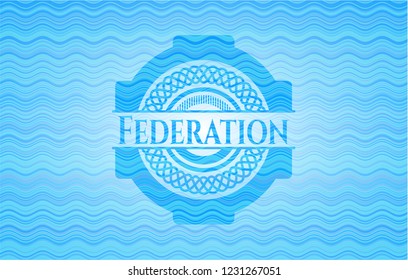 Federation light blue water wave badge.