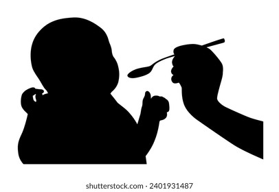 Feeding baby, charming little baby eating food, hand and food for infant child silhouette