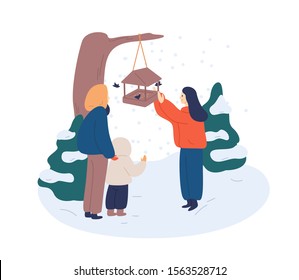 Feeding birds in winter flat vector illustration. Cheerful woman scattering breadcrumbs in feedbox for birdies cartoon character. Mother teaching children love nature, take care of wildlife animals.