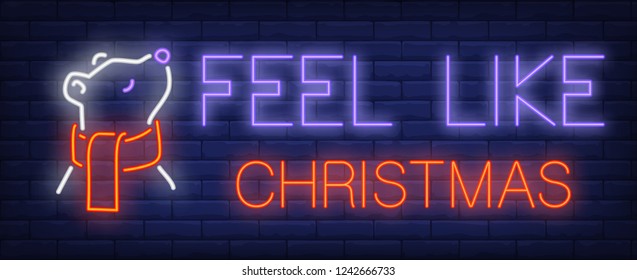 Feel like Christmas neon text with bear in scarf. Christmas advertisement design. Night bright neon sign, colorful billboard, light banner. Vector illustration in neon style.