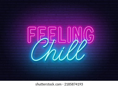 Feeling Chill neon quote on a brick wall.