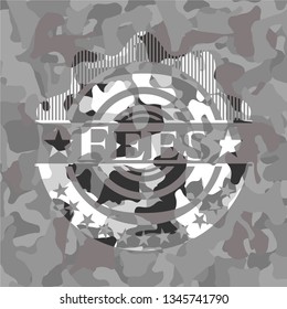 Fees on grey camouflaged texture