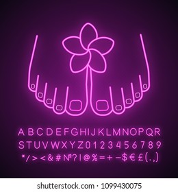Feet care neon light icon. Woman's feet with plumeria flower. Spa salon procedure. Glowing sign with alphabet, numbers and symbols. Vector isolated illustration