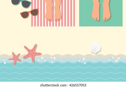 Feet of couple on beach