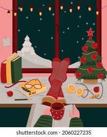 Feet in knitted socks are lying on the table. Hands with a mug of coffee and book. Christmas tree, red balls and candies on the table. Outside the window is a winter landscape. Vector illustration