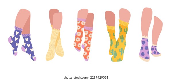 Feet in socks set. Collection of beautiful female legs in stylish and fashionable clothing elements. Autumn and winter accessory. Cartoon flat vector illustrations isolated on white background