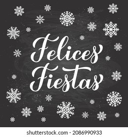 Felices Fiestas calligraphy hand lettering on chalkboard background with snowflakes. Happy Holidays in Spanish. Christmas and Happy New Year typography poster. Vector template for greeting card, etc.