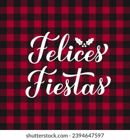 Felices Fiestas calligraphy hand lettering on red buffalo plaid background. Happy Holidays in Spanish. Christmas and Happy New Year typography poster. Vector template for greeting card, banner, etc