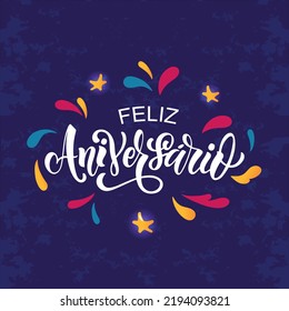 Feliz Aniversario handwritten phrase in Portuguese (Happy Birthday) colorful splashes on dark blue background. Hand lettering typography. Vector colorful illustration for greeting card, invitation