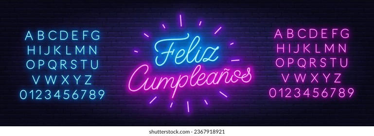 Feliz Cumpleanos neon lettering on brick wall background.