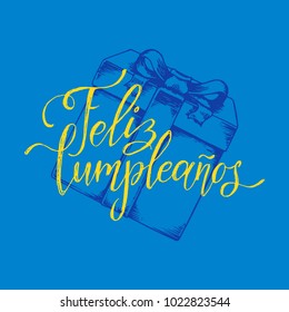 Feliz Cumpleanos translated from Spanish Happy Birthday hand lettering. Drawn illustration of gift box on blue background. Used for invitation, greeting card etc.