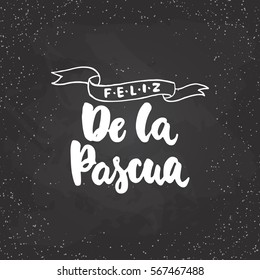 Feliz de la Pascua - lettering on spanish what means Happy Easter calligraphy phrase isolated on the background. Fun brush ink typography for photo overlays, t-shirt print, poster design