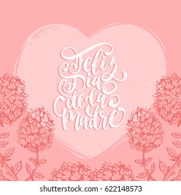 Feliz Dia De La Madre, spanish translation of the calligraphic inscription Happy Mother's Day. Hand lettering illustration with heart and flowers for greeting card, festive poster etc.