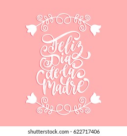 Feliz Dia De La Madre, spanish translation of the calligraphic inscription Happy Mother's Day. Hand lettering illustration with flowers for greeting card, festive poster etc.