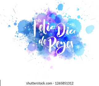 Feliz Dia de Reyes. Happy days of kings in spanish. Holiday background with calligraphy text on watercolor splash.