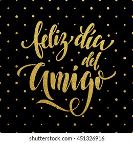 Feliz Dia del Amigo. Friendship Day golden lettering in Spanish for friends greeting card. Hand drawn vector gold calligraphy. Polka dot glitter black background.