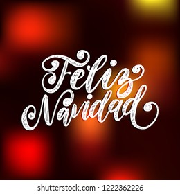 Feliz Navidad, handwritten phrase, translated from Spanish Happy New Year. Vector Christmas illustration on blurred background.