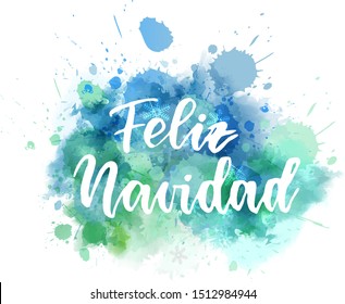 Feliz Navidad - Merry Christmas in Spanish. Abstract watercolor paint splash background. Holiday concept.