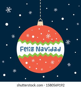 Feliz Navidad, Merry Christmas text on ball Decorative Christmas card element snowy dark background Spanish