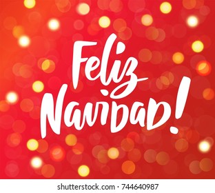 Feliz Navidad - spanish Merry Christmas text. Hand drawn letters. Red and gold glowing lights background. Holiday greetings quote. Great for Christmas and New year cards, party posters, gift tags.