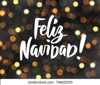 Feliz Navidad - spanish Merry Christmas hand drawn text. Glowing golden lights on dark background, bokeh effect. Holiday greetings quote. For Christmas and New year cards, party posters, gift tags.