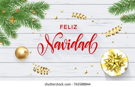 Feliz Navidad Spanish Merry Christmas golden decoration and calligraphy font on white wooden background for greeting card. Vector Christmas or New Year gold shiny star on Xmas tree for winter holiday