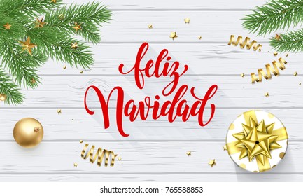 Feliz Navidad Spanish Merry Christmas golden decoration, greeting card calligraphy font on white wooden background. Vector Christmas tree or New Year gift winter holiday gold shiny confetti decoration