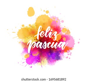 Feliz Pascua - Happy Easter in Spanish. Abstract watercolor imitation splash background with handwritten calligraphy text. Easter concept background.