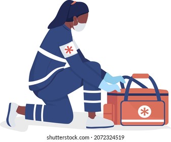 Female ambulance attendant semi flat color vector character. Full body person on white. Nurse with disaster supplies kit isolated modern cartoon style illustration for graphic design and animation