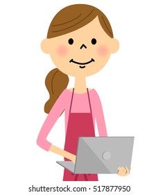 The female of the apron with a laptop computer