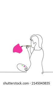 female artist with palette paints with brush with pink paint on wall or sheet - one line drawing vector. art therapy process concept, female artist creates abstract art