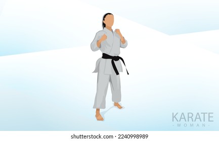 A female athlete stands in a karate combat stance. Abstract background.