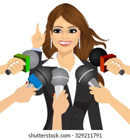 female brunette politician or businesswoman answering press questions in front of journalists holding microphones