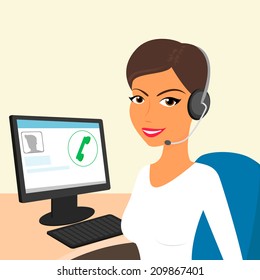 Female call centre operator with headset sitting in the office.