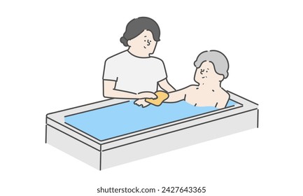 A female caregiver assisting an elderly woman with bathing