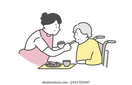 A female caregiver assisting an elderly woman with meals