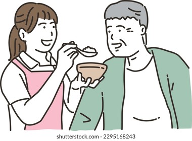A female caregiver and an elderly man who assists with meals
