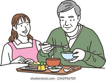 A female caregiver and an elderly man who assists with meals
