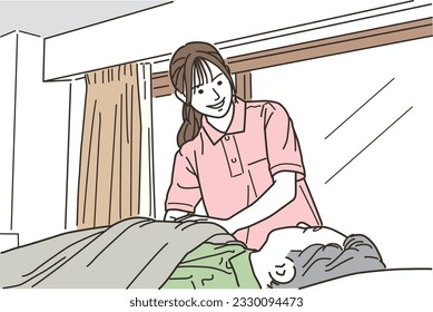 Female caregiver helping the elderly in bed
