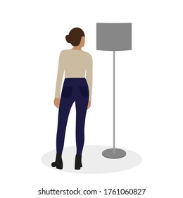 Female character looks at a floor lamp on a white background