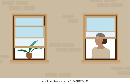 Female character in one of the windows of the house