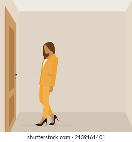 A female character in a pantsuit stands in front of a closed door in an empty room