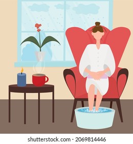 female character is sitting in an easy chair in a bathrobe and making a foot bath. It's winter outside, there's a cup of coffee and a candle on the table.Cute cosy home illustration in a flat style.