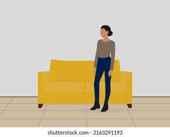 A female character is standing near a sofa indoors