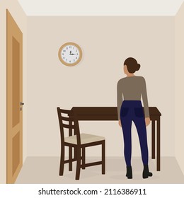 A female character stands in a room near the table and looks at the clock hanging on the wall