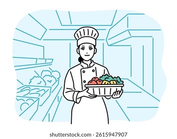 Female chef holding ingredients in the kitchen