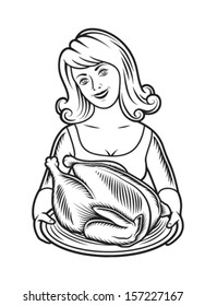 female chef holding a tray with roasted turkey